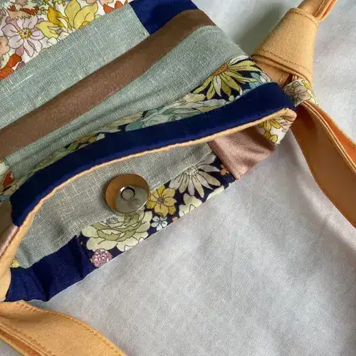 Upcycled patchwork phone bag in tan and navy